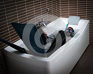 Crazy diver in a jacuzzi bathtub