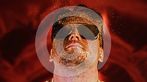 Crazy fun positive face man in gold glitter. Comical photo shake head funny person. Expression emotion guy in sunglasses
