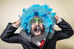 Crazy funny bearded man with blue wig