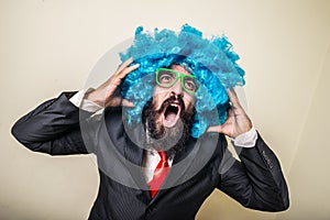 Crazy funny bearded man with blue wig