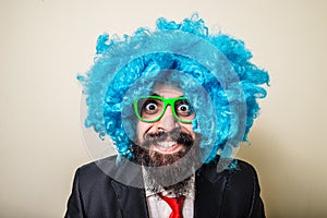 Crazy funny bearded man with blue wig