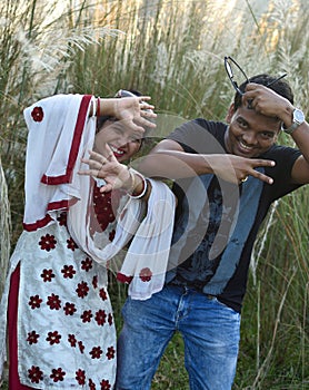 Crazy, funny and happy Indian couple enjoying a playful moment while bonding