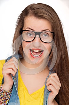 Crazy girl with braces wearing geek glasses