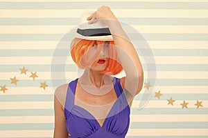 Crazy girl in hat. fashion woman with orange hair. Glamour fashion model. Stylish girl with crazy look. Beauty and
