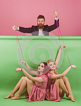 Crazy girls and man on pink. Halloween. holidays and dolls. dominance and dependence. Creative idea. Love triangle