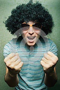 Crazy happy dude in afro wig