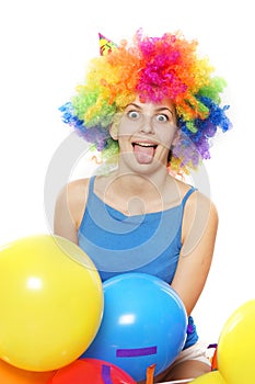 Crazy happy woman with colored hair over white