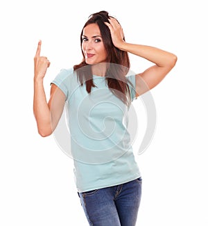 Crazy hispanic female pointing up her finger