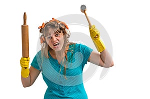 Crazy housewife with kitchen roller and meat hammer