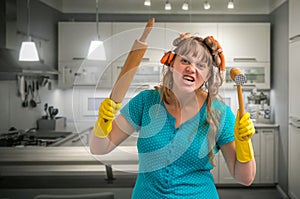 Crazy housewife with roller and meat hammer