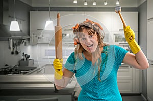 Crazy housewife with roller and meat hammer