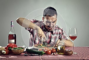 Crazy hungry man eating pizza