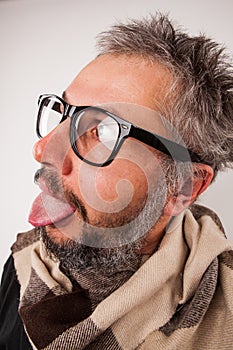 Crazy looking old man with grey beard with nerd big glasses