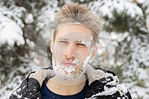 Crazy mad bearded man frost face covered by snow, emotional face portrait, winter season f