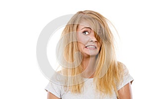 Crazy, mad blonde woman with messy hair