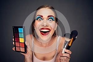 Crazy make up artist with clown worst make up. photo