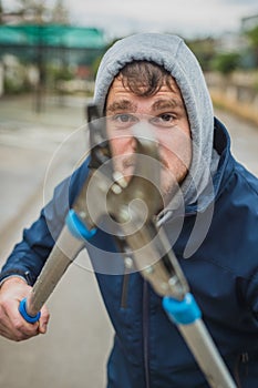Crazy man attacking with scissors