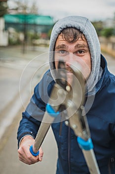 Crazy man attacking with scissors