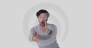 Crazy man giving thumbs up gesture and disappearing over white background