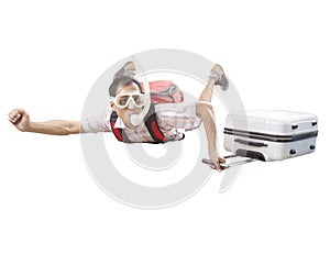 Crazy man wearing snorkeling mask flying mid air with traveling