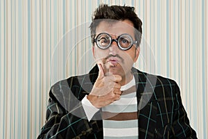 Crazy nerd man myopic thinking funny gesture photo