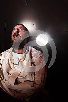 Crazy person in a straitjacket