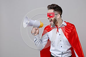 Crazy powerful business man in shirt superhero suit have supernatural abilities isolated on grey wall background