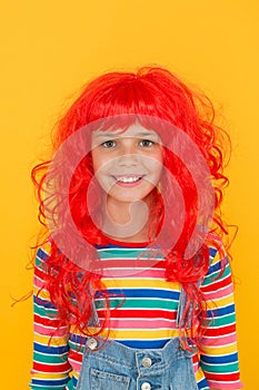 Crazy redhead wig. Messy hairstyle. Kid cheerful smiling happy redhead girl. I am ginger and proud of it. Redhead