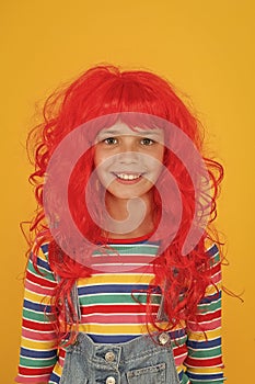 Crazy redhead wig. Messy hairstyle. Kid cheerful smiling happy redhead girl. I am ginger and proud of it. Redhead