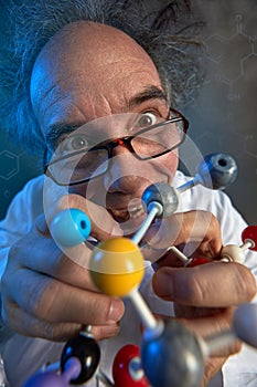 Crazy scientist with model molecules