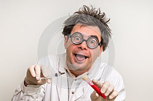 Crazy scientist performing experiments in laboratory