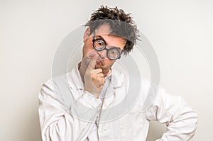 Crazy scientist thinking about his experiment