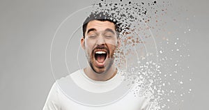 Crazy shouting man in t-shirt over gray background