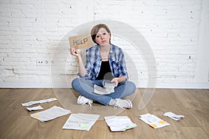 Crazy stressed woman with calculator and bank and bills paperwork and documents doing domestic financial accounting