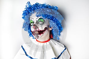 Crazy ugly grunge evil clown. Scary professional Halloween masks. Halloween party