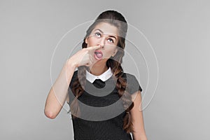 Crazy well dressed woman doing comic face and have idiotic look