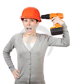 Crazy woman with orange hard hat and drill