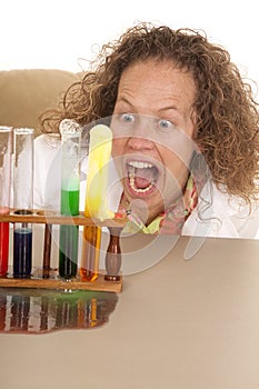 Crazy woman scientist with test tubes mouth open