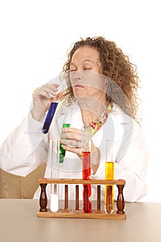Crazy woman scientist with test tubes scrunch face photo