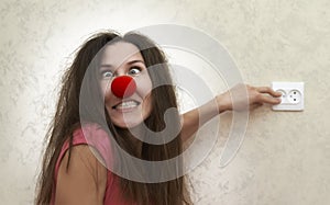 Crazy woman thinks she is a light bulb photo