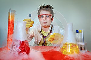 Crazy young scientist performing experiments in lab