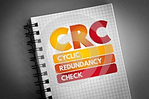 CRC - Cyclic Redundancy Check acronym on notepad, technology concept background