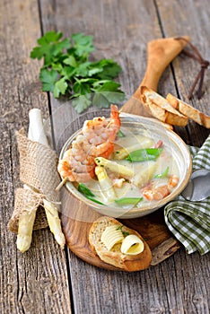 Cream of asparagus soup with prawns