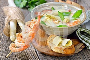 Cream of asparagus soup with prawns