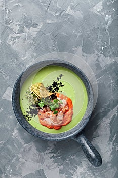 Cream of asparagus soup with shrimp. Green asparagus soup with tiger prawns, Food photo, healthy eating, wholesome food.