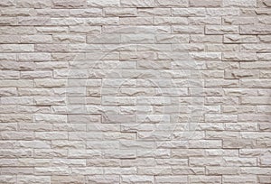 Cream and beige brick wall texture background. Brickwork and stonework flooring interior rock old pattern clean concrete grid