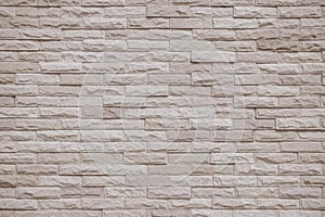 Cream and beige brick wall texture background. Brickwork and stonework flooring interior rock old pattern clean concrete grid