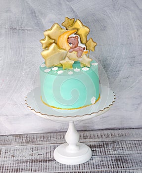 Cream cheese blue kid cake with gingerbread teddy and stars