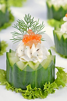 Cream cheese with caviar on cucumber