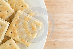 Cream cheese and chives crackers on a white plate